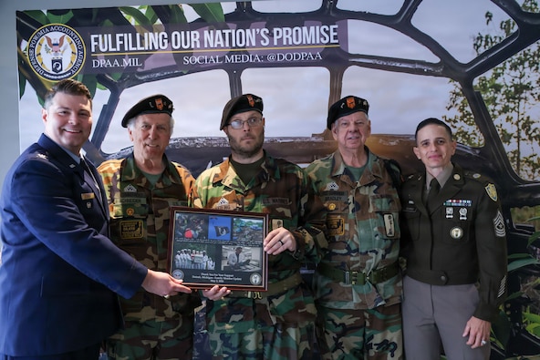 U.S. Air Force Col. Derek Rankin, chief of staff for the Defense POW/MIA Accounting Agency and U.S. Army Sgt. Maj. Lauren Flores, the DPAA senior enlisted advisor pose for a photo with Vietnam Veterans of America Chapter 154 during a Family Member Update in Detroit, Mi., May 2, 2026.