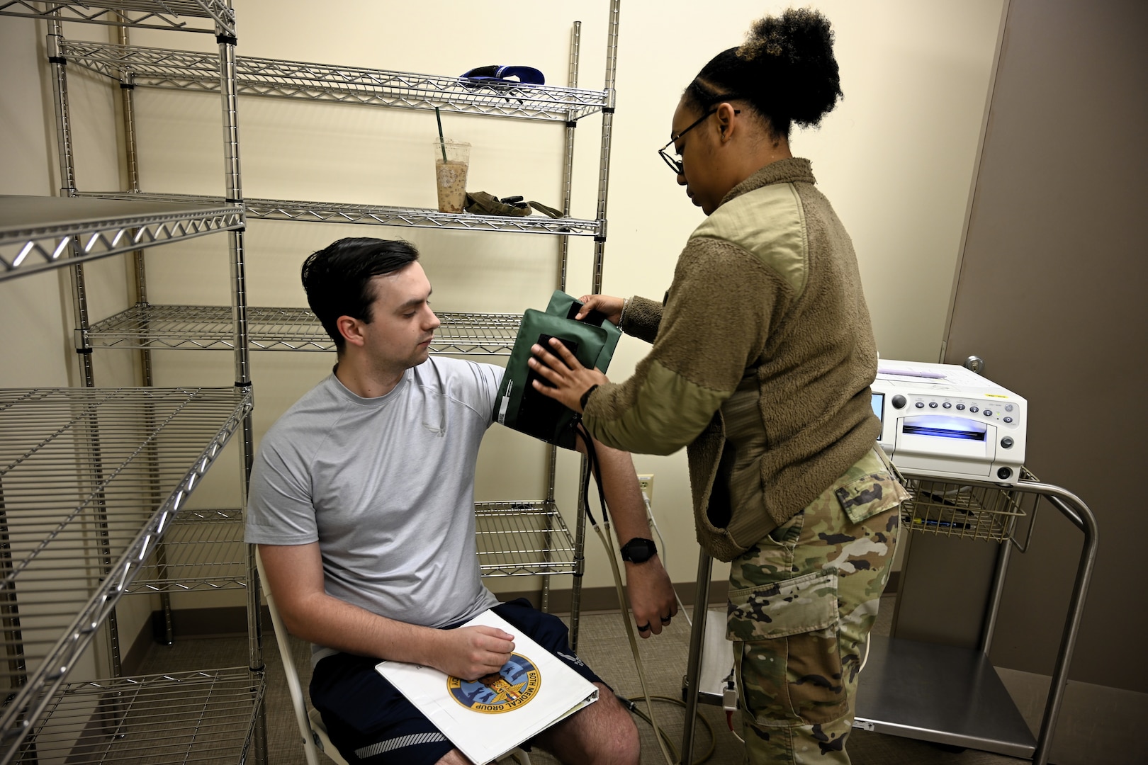An Airman with the 60th Medical Group performs a blood pressure screening during a Continuous Medical Readiness event at David Grant USAF Medical Center, Travis Air Force Base, Calif., February 24, 2026. The initiative is designed to improve coordination between specialty clinics and accelerate deployment status updates.