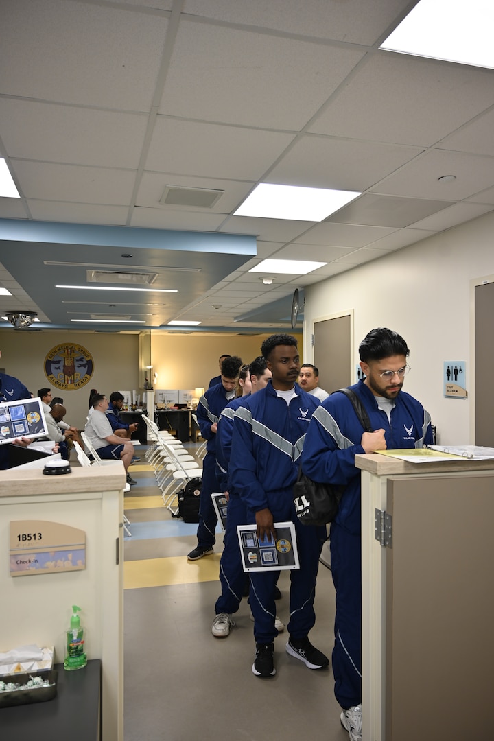 Airmen from Travis Air Force Base, Calif., move through the Continuous Medical Readiness Cell during a processing event at David Grant USAF Medical Center, March 23, 2026. The initiative was developed to reduce appointment delays, improve patient flow and provide Airmen with a more predictable readiness experience.