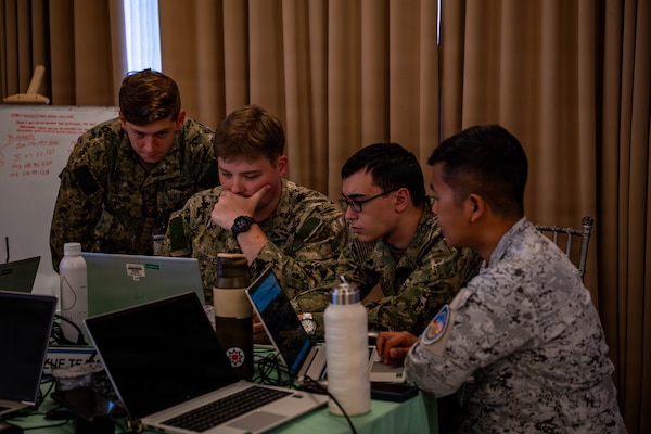 U.S. Navy and Philippine Navy service members work together during a cyber defense exercise in support of Exercise Balikatan 2026 at Camp Gen. Emilio Aguinaldo, Manila, Philippines, April 28, 2026.