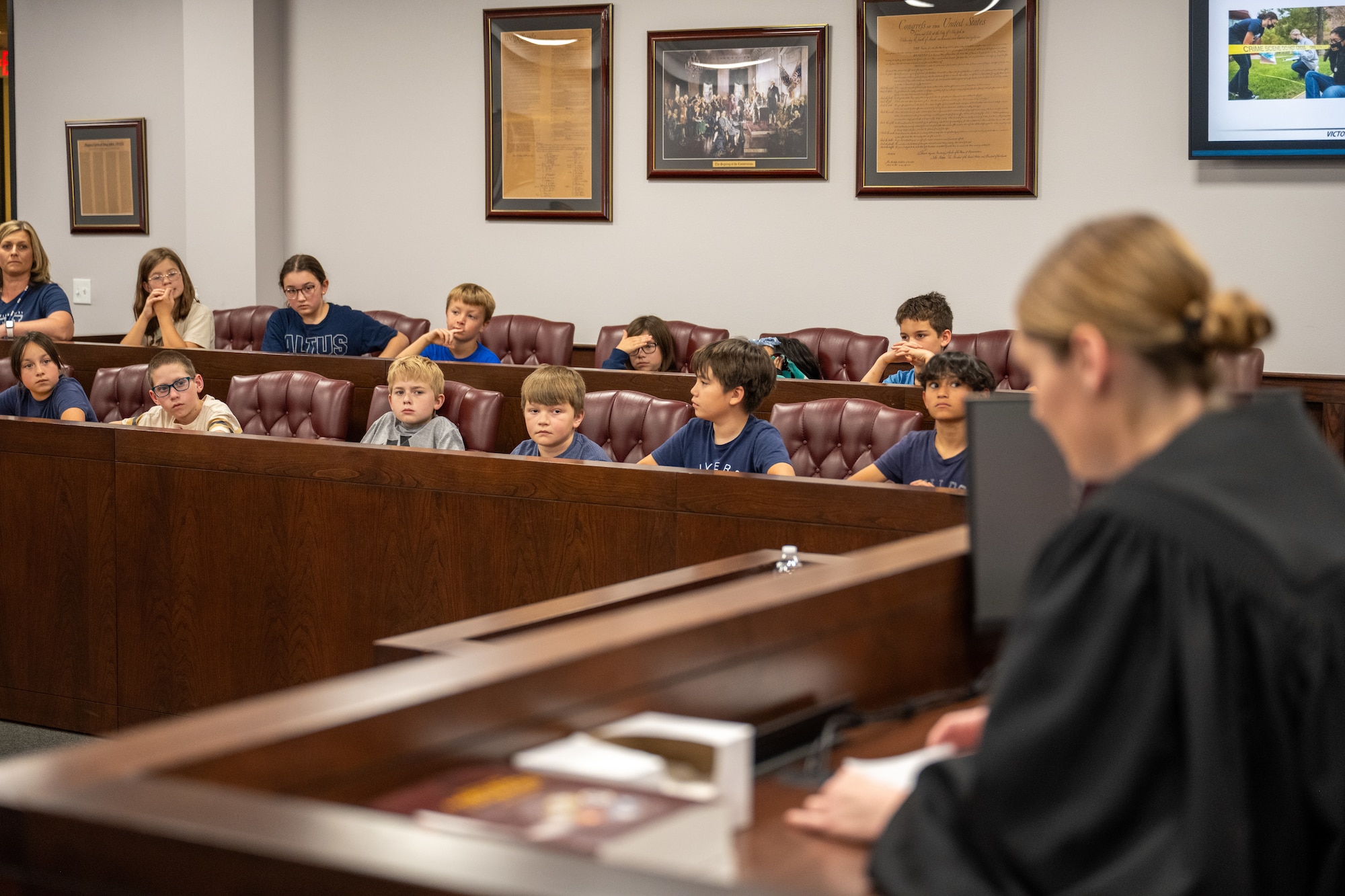 U.S. Air Force Capt. Samantha Hullibeger, 97th Air Mobility Wing military justice chief, leads a mock trial at Altus Air Force Base, Oklahoma, May 1, 2026. The mock trial gave local fourth-grade students a hands-on look at courtroom procedures and the legal process as part of a Law Day event hosted by the 97th AMW Judge Advocate office. (U.S. Air Force photo by Airman 1st Class Nathan Langston)