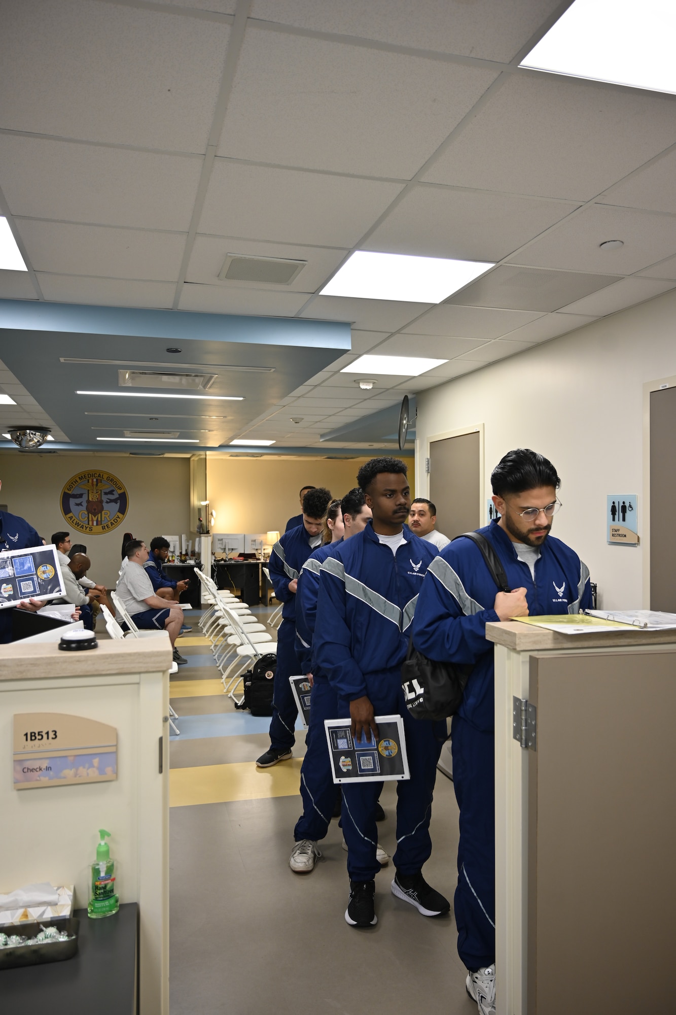 Airmen from Travis Air Force Base, Calif., move through the Continuous Medical Readiness Cell during a processing event at David Grant USAF Medical Center, March 23, 2026. The initiative was developed to reduce appointment delays, improve patient flow and provide Airmen with a more predictable readiness experience.