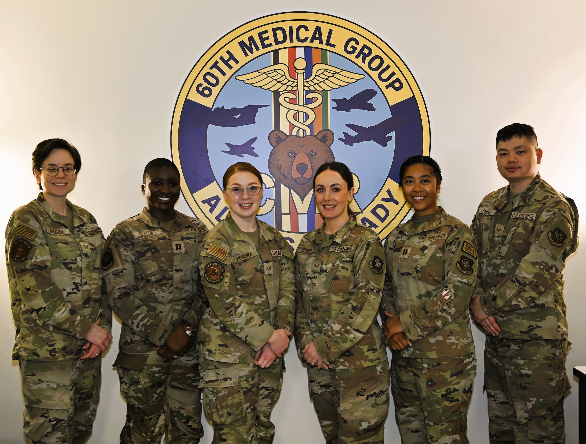 Members of the Continuous Medical Readiness (CMR) Cell at David Grant USAF Medical Center pose for a group photo at Travis Air Force Base, Calif., April 7, 2026. The CMR Cell supports medical readiness operations by coordinating deployment-related medical requirements and guiding Airmen through a streamlined readiness process. Capt. Isabella M. Cordova, officer in charge of the CMR Cell, is pictured fifth from left.