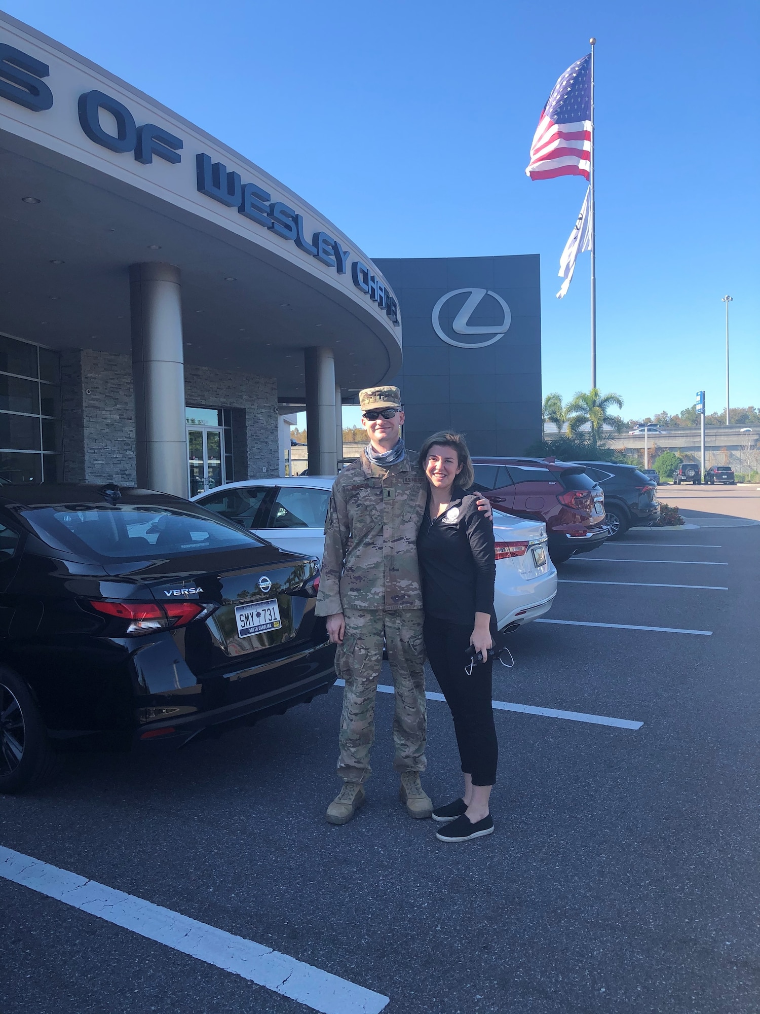 1st Lt. Alexander Johnson, left, a security forces officer, and his sister, Mary Johnson, smile for a photo in December 2020. Johnson surprised his sister after returning from his first deployment to thank her for the emotional support and wingmanship she provided him. (Courtesy photo)