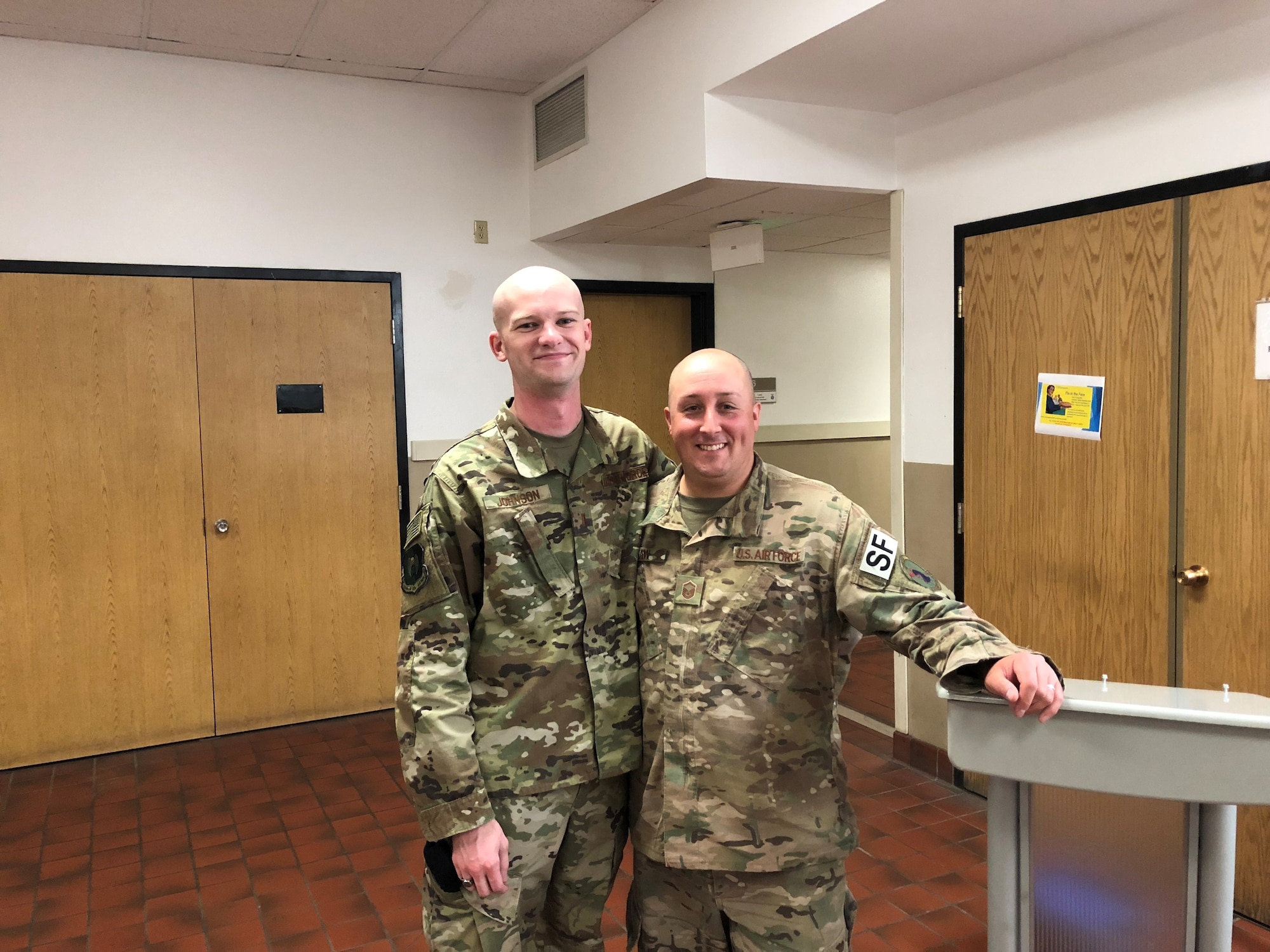 2nd Lt. Alexander Johnson, left, 5th Security Forces Squadron officer, poses for a photo with Master Sgt. Phillip Besaw, 5th SFS flight chief, in 2018. Johnson and Besaw responded to numerous security forces incidents together. Johnson considers Besaw a father figure who played a significant role in his professional and personal development. (Courtesy photo)