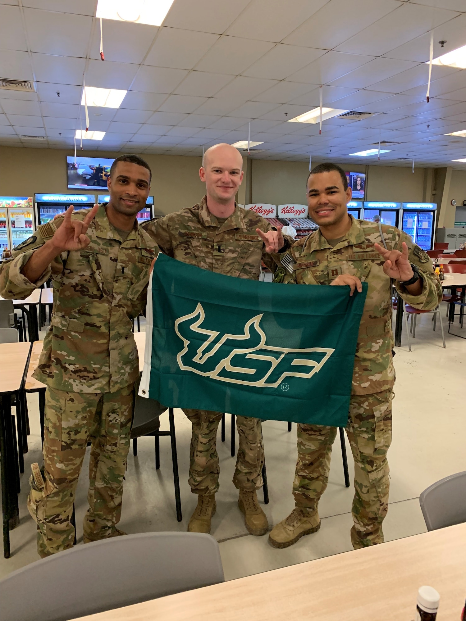From left, 1st Lt. Marcos Morrero-Disla, 1st Lt. Alexander Johnson  and Capt. Aryk Bingham Hill, all graduates of Air Force Reserve Officer Training Corps Detachment 158, pose for a photo together in February 2020. Johnson encountered the two AFROTC friends from the University of South Florida while on deployment to Al Udeid Air Base, Qatar, where they provided one another with mutual support. (Courtesy photo)