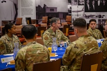 U.S. Air Force Gen. Kevin Schneider, Pacific Air Forces commander, engages with enlisted Airmen during a breakfast at Kadena Air Base, Japan, April 29, 2026. The discussion provided an opportunity to hear directly from Airmen about their roles in sustaining day-to-day operations and mission readiness. (U.S. Air Force photo by Airman 1st Class Francisco Huerta)
