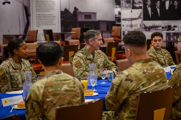 U.S. Air Force Gen. Kevin Schneider, Pacific Air Forces commander, engages with enlisted Airmen during a breakfast at Kadena Air Base, Japan, April 29, 2026. The discussion provided an opportunity to hear directly from Airmen about their roles in sustaining day-to-day operations and mission readiness. (U.S. Air Force photo by Airman 1st Class Francisco Huerta)