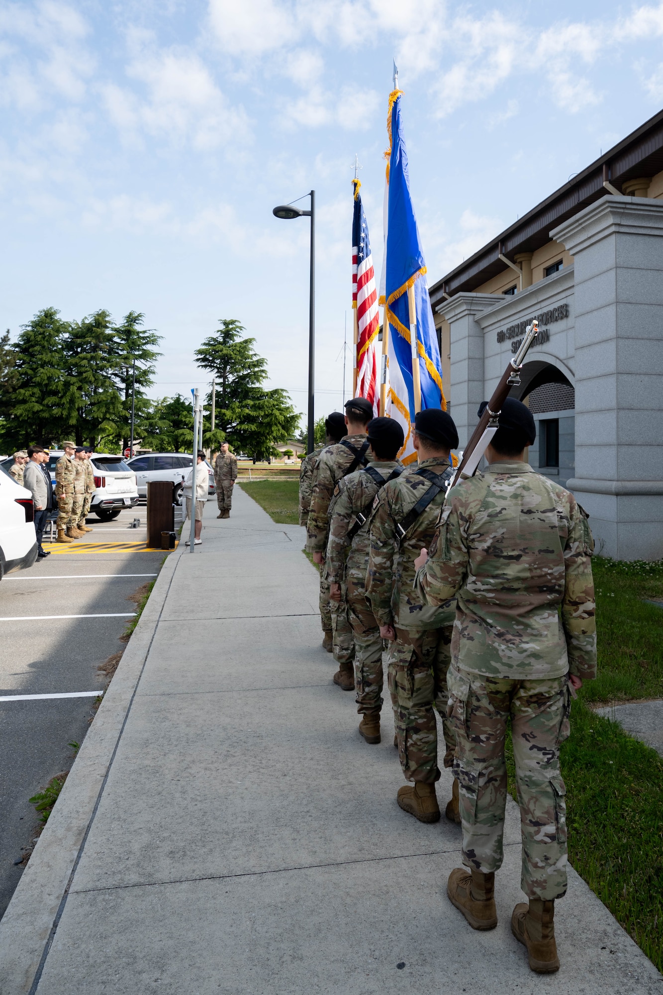 Honor Guard carries flags.