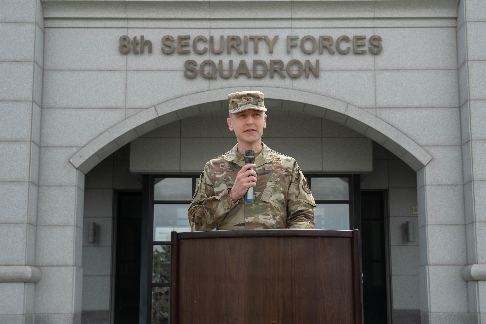 Leadership gives remarks at ceremony.