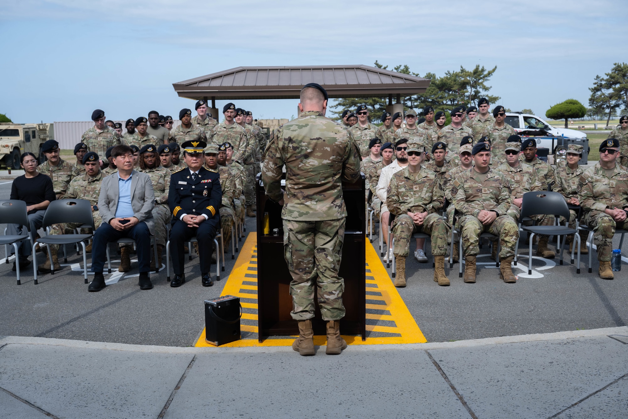 Airman gives remarks at ceremony.