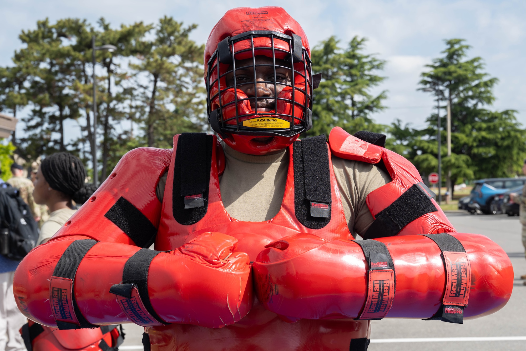Airman wears full body protection suit.