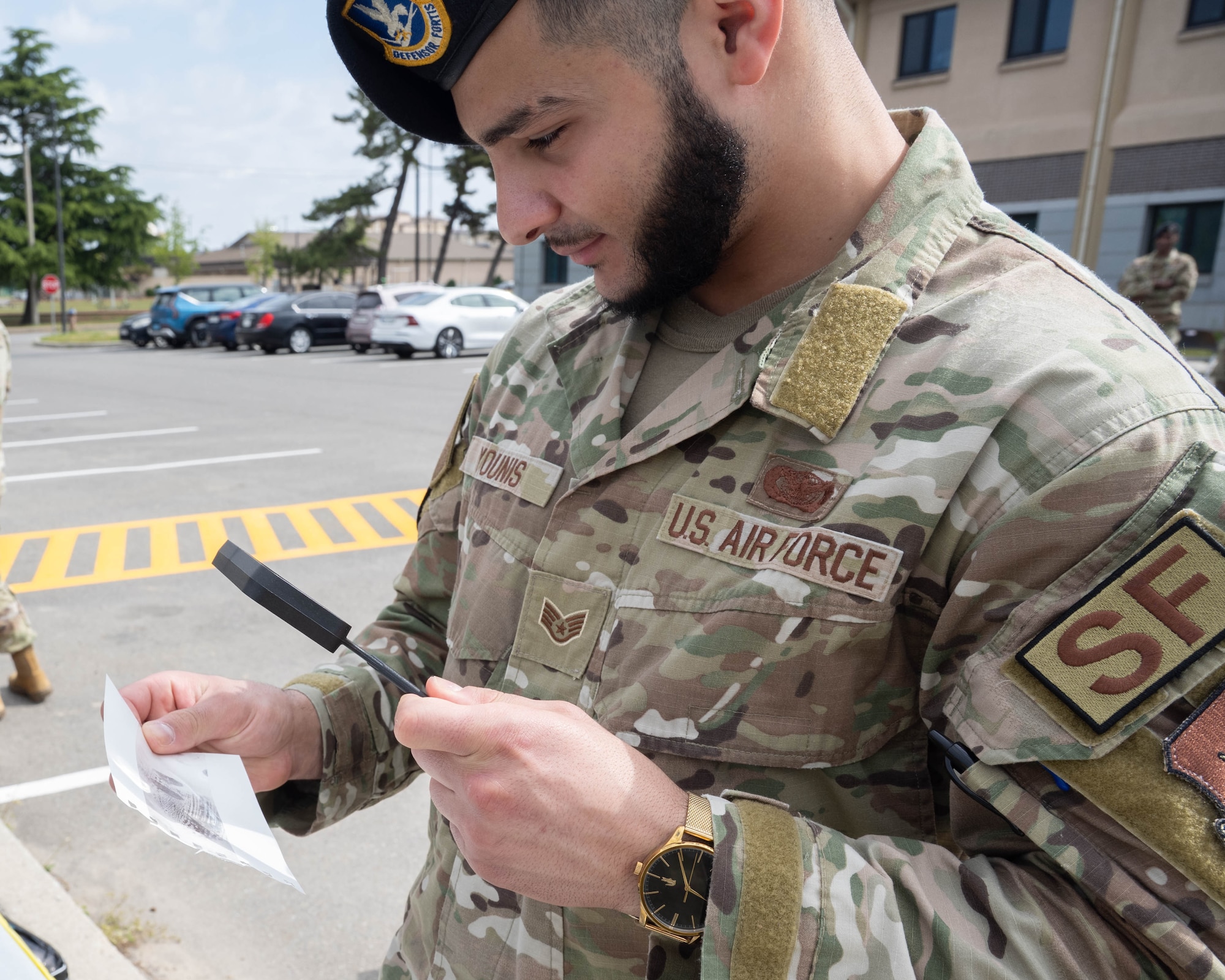 Airman looks at fingerprints.