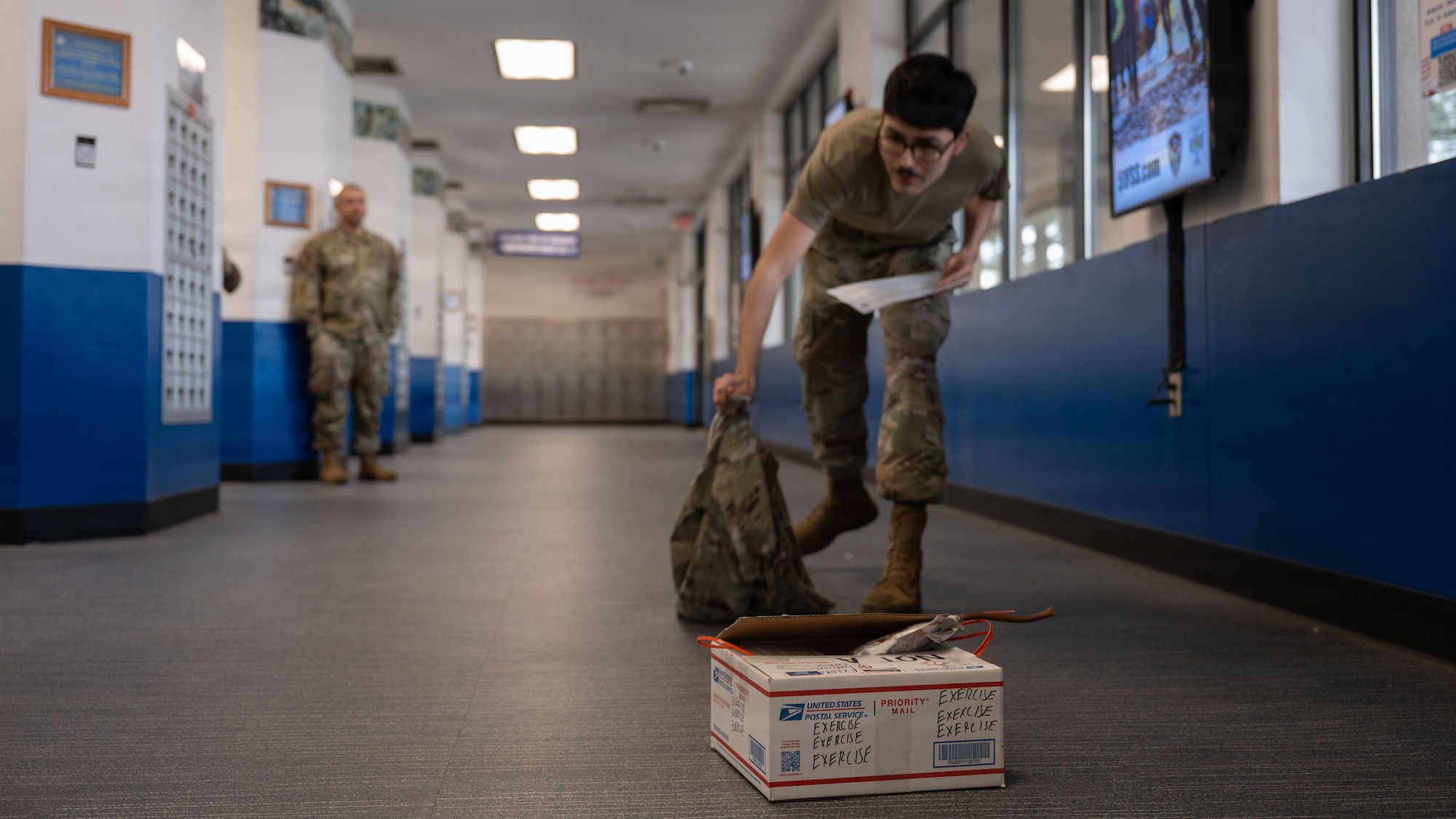 A U.S. Airman assigned to the 51st Force Support Squadron uses his clothing as a marker in response to a simulated bomb threat during Mustang Rodeo at Osan Air Base, Republic of Korea, May 11, 2026. The exercise provided an opportunity for units across the installation to refine procedures and improve interoperability during emergency situations. (U.S. Air Force photo by Senior Airman Rome Bowermaster)