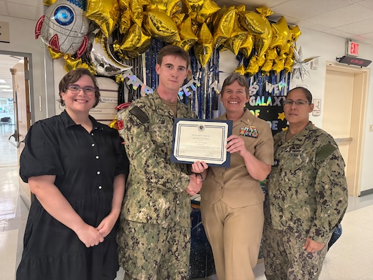 260424-N-LY941-4010
GUANTANAMO BAY, Cuba - Hospital Corpsman 3rd Class Ethan R. Meyer receives a Patient Safety Champion Certificate of Recognition at U.S. Naval Hospital Guantanamo Bay, April 24, 2026. Meyer’s attention to detail during a patient intake identified inconsistencies with a routine illness, prompting escalation to a higher level of care and reinforcing a patient-centered approach to safety. (U.S. Navy photo by Emily McCamy)
