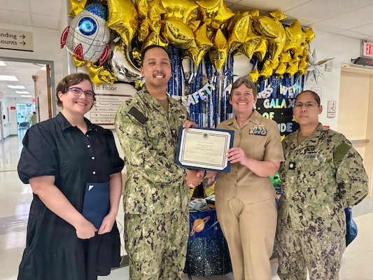 260424-N-LY941-4001
GUANTANAMO BAY, Cuba - Hospital Corpsman 1st Class Anthony D. Lagpacan receives a Patient Safety Champion Certificate of Recognition at U.S. Naval Hospital Guantanamo Bay, April 24, 2026. Lagpacan, a member of U.S. Navy Medicine Readiness and Training Command Guantanamo Bay, was recognized for his leadership as a safety representative and senior radiology technologist, advancing initiatives that improved safety, quality, and operational efficiency. (U.S. Navy photo by Emily McCamy)