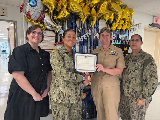 260424-N-LY941-4002
GUANTANAMO BAY, Cuba - Lt. Katherine C. Rubio-Jackson receives a Patient Safety Champion Certificate of Recognition at U.S. Naval Hospital Guantanamo Bay, April 24, 2026. Rubio-Jackson, a member of U.S. Navy Medicine Readiness and Training Command Guantanamo Bay, was recognized for her leadership as a clinic manager, driving process improvements and standardization efforts that strengthened safe, high-quality patient care. (U.S. Navy photo by Emily McCamy)