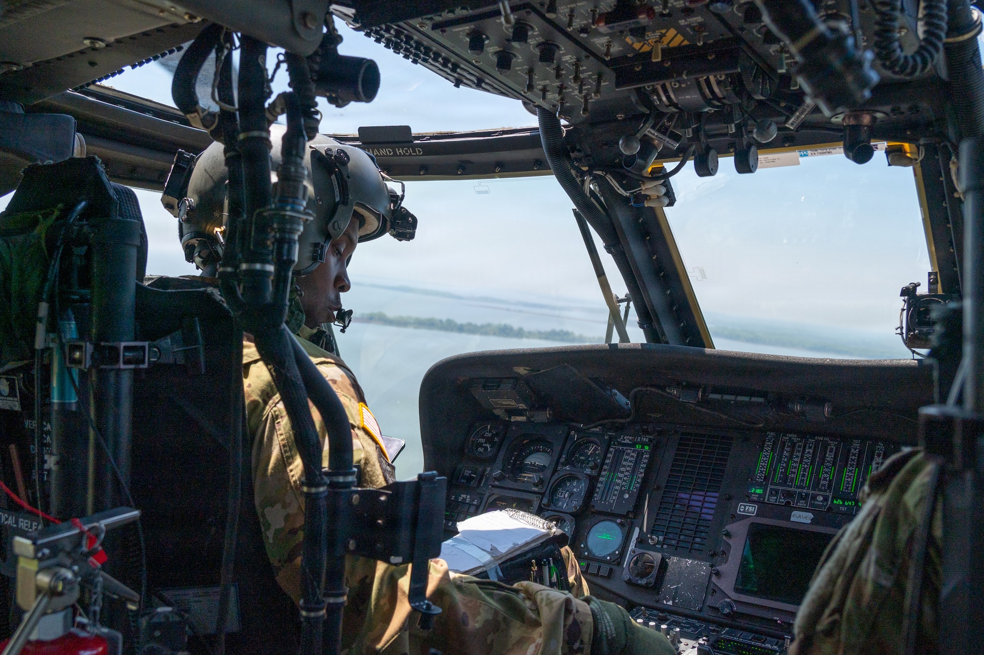 A Maryland Army National Guard pilot for the 29th Combat Aviation Brigade flies a UH-60 Black Hawk during a Maryland Emergency Management Search and Rescue Exercise over Gunpowder Falls State Park, Maryland, April 23, 2026. State agencies, local jurisdictions, and non-governmental organizations gathered in Baltimore County to test their skills through a series of immersive scenarios during the 12-hour operational period. (U.S. Air National Guard Photo by Senior Airman Sarah Hoover)