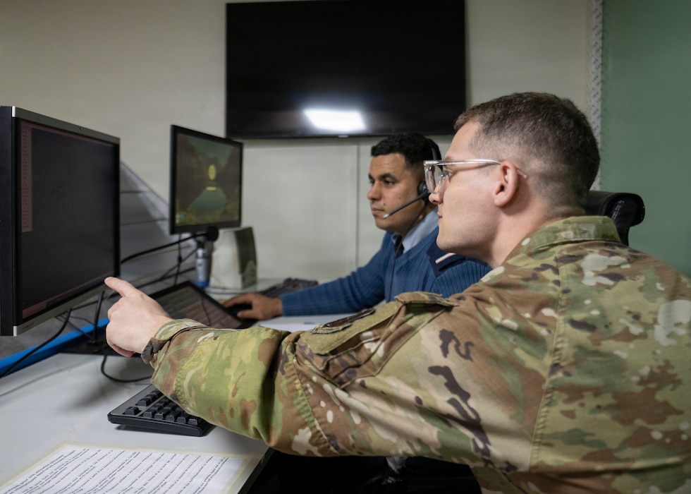 two men starring at a screen