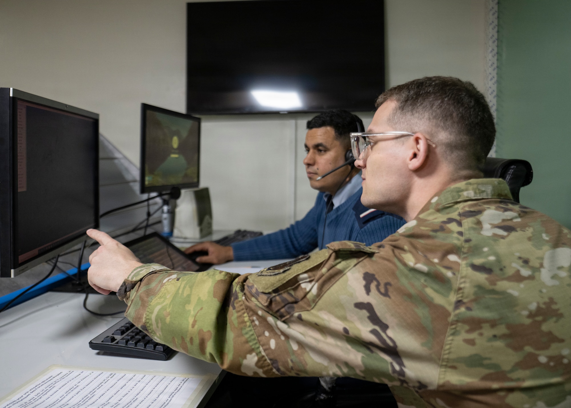 two men starring at a screen