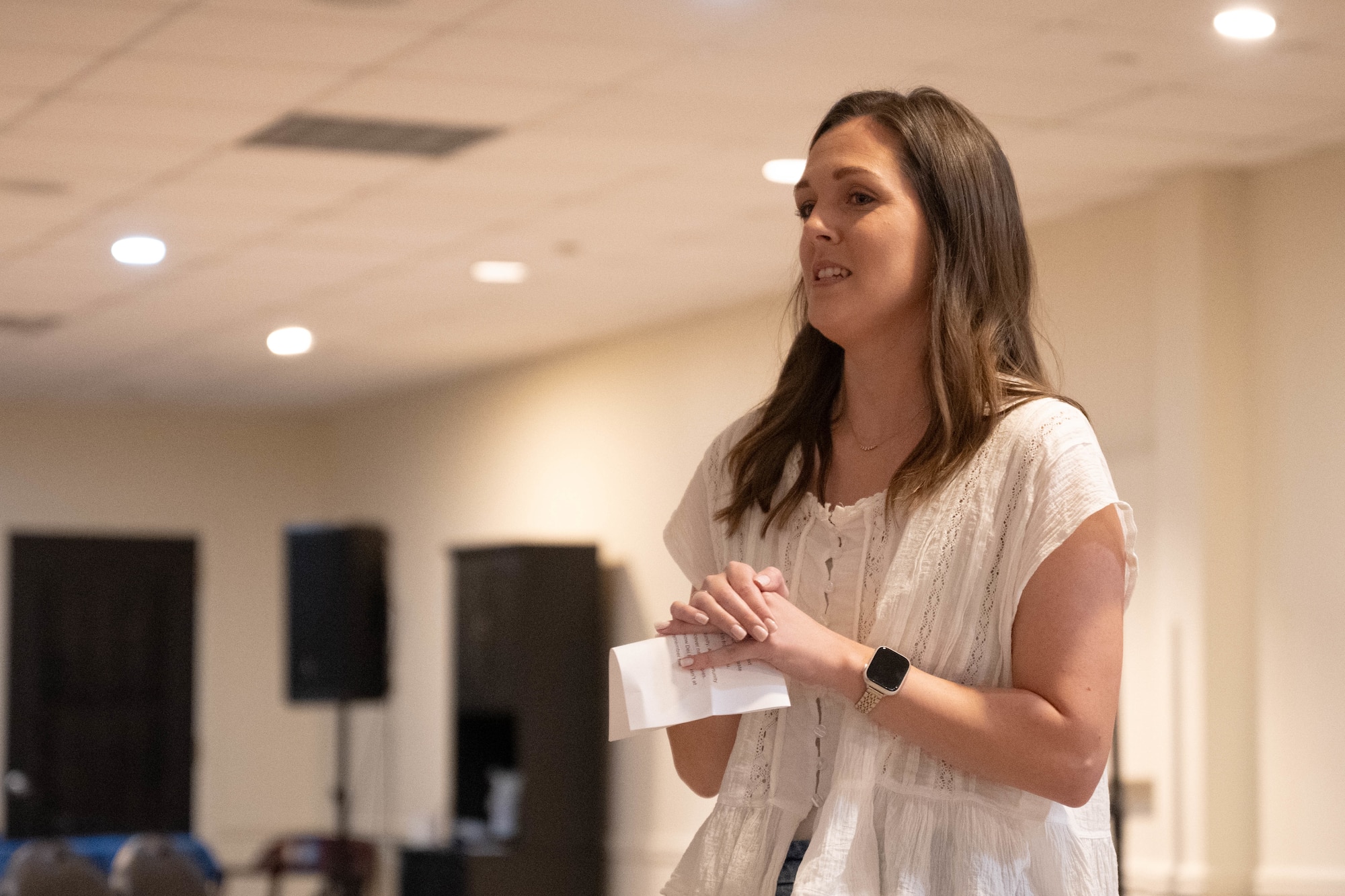 Abigail Germain, 47th Student Squadron unit training manager, delivers remarks during the opening ceremony for Military Spouse Appreciation Day at Laughlin Air Force Base, Texas, May 8, 2026. Germain shared her experiences as a military spouse and what it means to her. (U.S. Air Force photo by Airman 1st Class Darryl Keith)