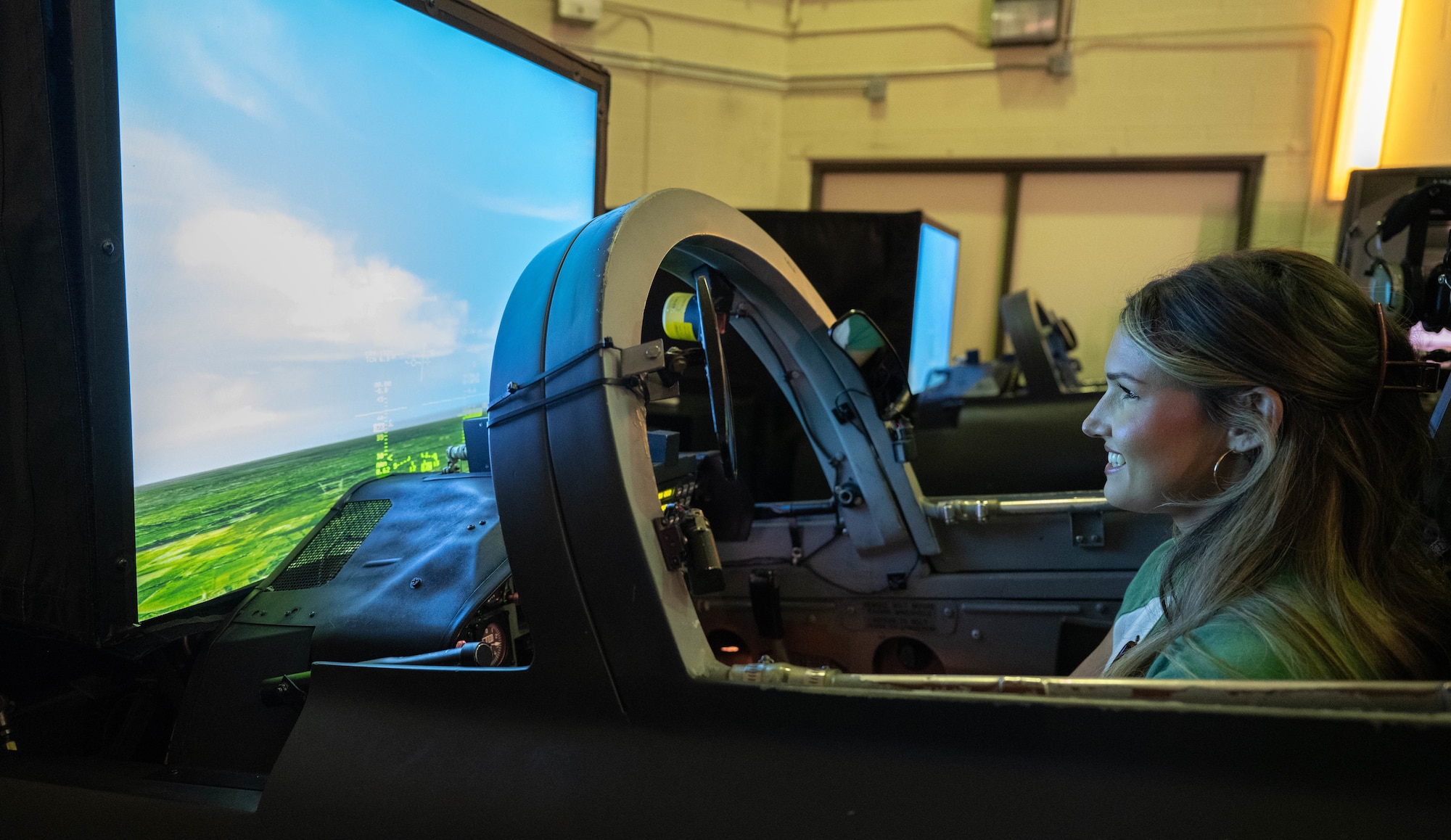 A military spouse pilots a T-38C Talon simulator during Military Spouse Appreciation Day at Laughlin Air Force Base, Texas, May 8, 2026. Spouses and families of military members on base received tours from various units to learn about their daily operations. (U.S. Air Force photo by Airman 1st Class Darryl Keith)