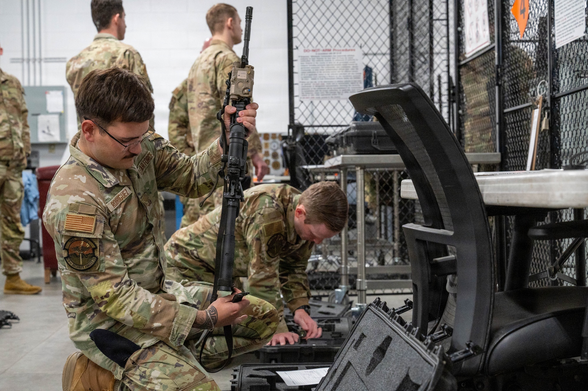 Airman checks weapon