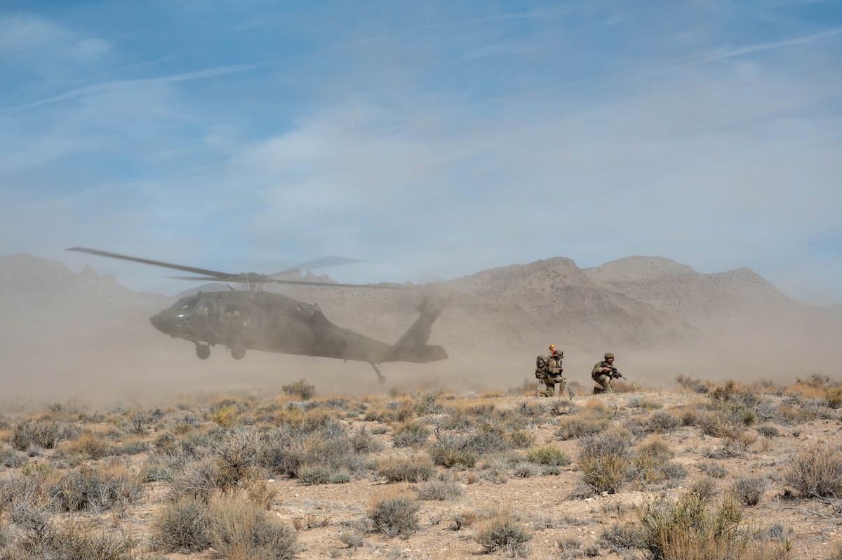 Helicopter lands in desert