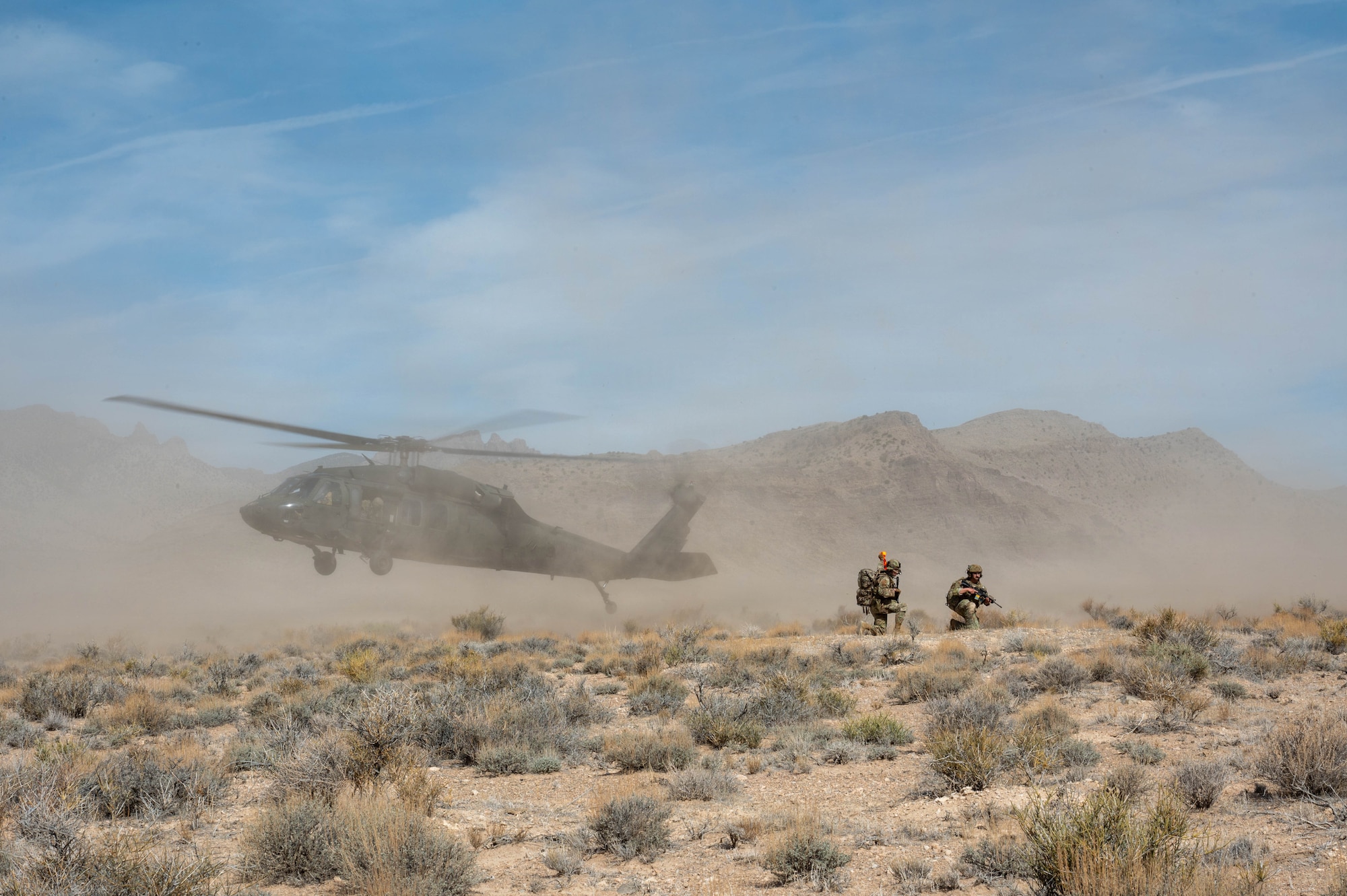Helicopter lands in desert