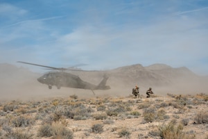 Helicopter lands in desert