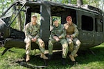 Indiana National Guard Master Sgt. Thuc Tran, the operations sergeant for Indiana's State Partnership Program, Sgt. Ondrej Macak and Sgt. 1st Class Matus Fulop, soldiers with the Slovak Armed Forces, pose for a photo at Camp Atterbury, near Edinburgh, Indiana, April 4, 2026. The Slovak team trained for the Winston P. Wilson Championship held at Camp Robinson, North Little Rock, Arkansas. Photo by Staff Sgt. Hector Tinoco.