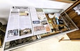 A full display of the 617th Military Police Company time capsule discovered at Fort McCoy is shown April 29, 2026, that is now on display at the Fort McCoy History Center at Fort McCoy, Wis. In November 2004, the 617th Military Police Company of the Kentucky National Guard was one of many military units completing their mobilization at Fort McCoy for deployment. Before they left, however, some members of the unit decided they'd put together a “time capsule” of sorts in a plastic drawer they got from the Fort McCoy Exchange, put some mementos in it, and stash it away in the walls of one of the hundreds of barracks on the installation’s cantonment area. But after their deployment, members of the unit never went back to find their time capsule. Whoever stashed the drawer of mementos into the wall did it well because it remained undiscovered for 19 years. The time capsule was found in fall 2022 when contractors were beginning major renovations on 200 of the barracks at Fort McCoy. (U.S. Army Photo by Scott T. Sturkol, Fort McCoy Public Affairs Office)
