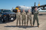From left to right, U.S. Air Force Tech. Sgt. Martha Ray, safety technician; Master Sgt. Heather Metzler, safety technician; Senior Master Sgt. Jessica Deal, occupational safety manager; and Lt. Col. Phillip Battles, chief of safety, 189th Airlift Wing safety team, pose in front of a C-130H and safety truck at Little Rock Air Force Base, Arkansas, May 3, 2026. Along with Senior Master Sgt. Jerod Indorf, flight safety senior noncommissioned officer they earned three 2025 Air National Guard Safety Awards: as a team for best safety program, and individual honors for professional of the year and civilian of the year to Metzler and Deal, respectively. Their expertise and dedication are a standard of excellence, and have been integral to Airmen’s safety and the 189th Airlift Wing's aircraft conversion to the C-130J Super Hercules. Photo by Tech. Sgt. Christopher Sherlock.