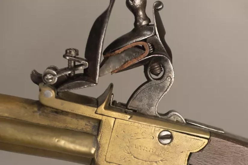 A pistol trigger mechanism is on display.