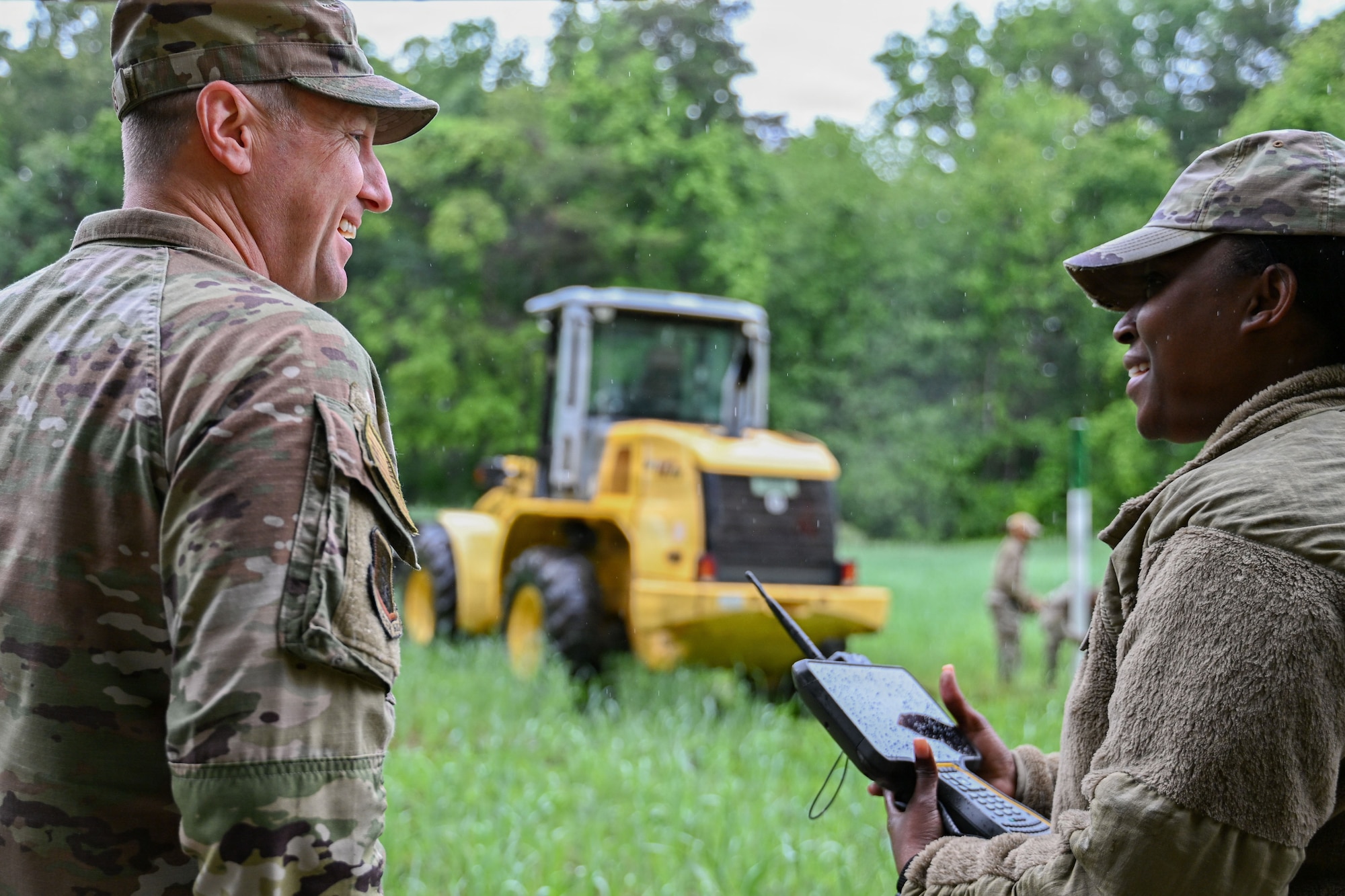 U.S. Air Force Senior Airman Sashakay T. Christie, an engineering assistant supervisor assigned to the 316th Civil Engineer Squadron, explains the functions of a TF7 controller