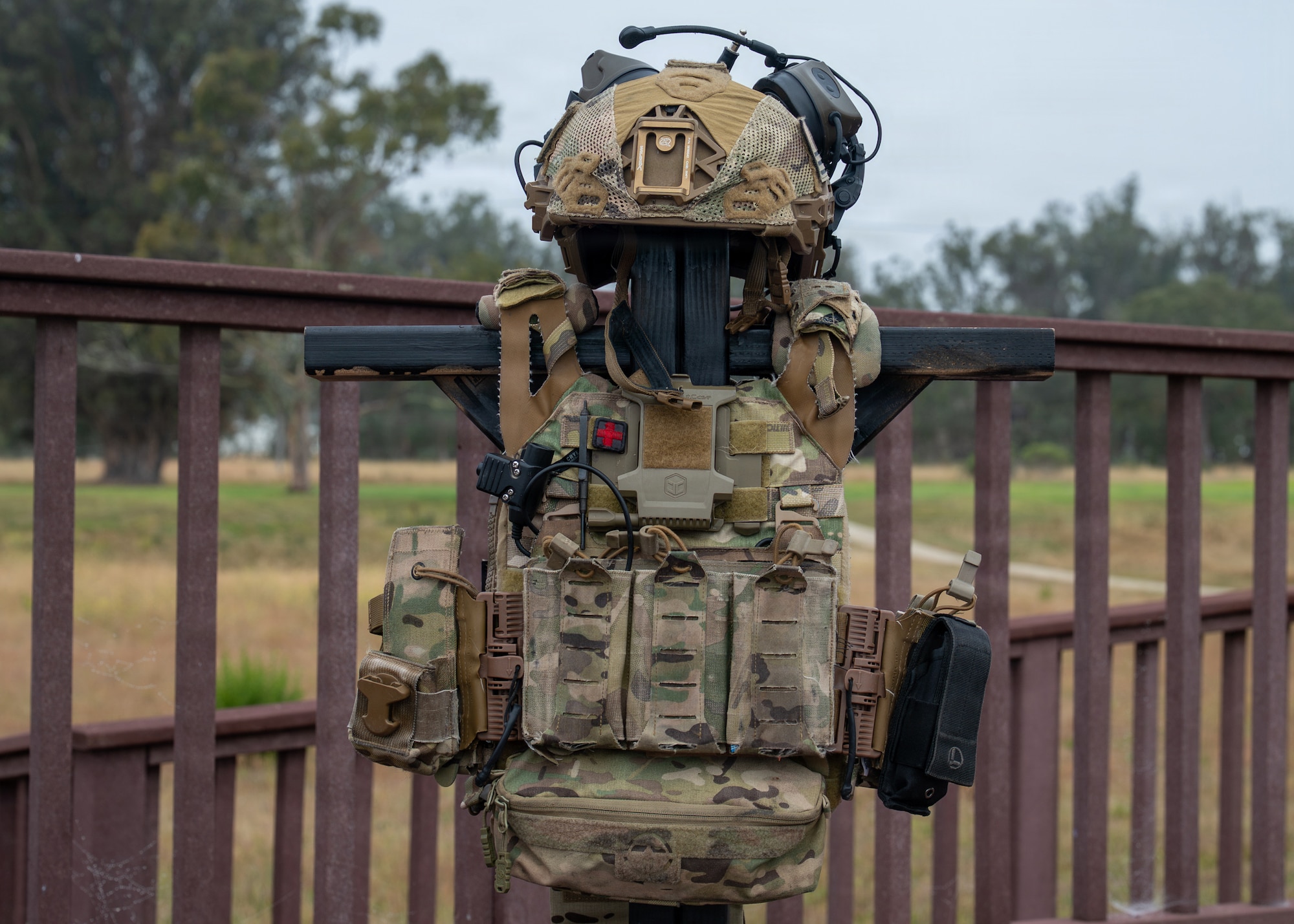 A 30th Security Forces Squadron tactical uniform rests on an armor stand.