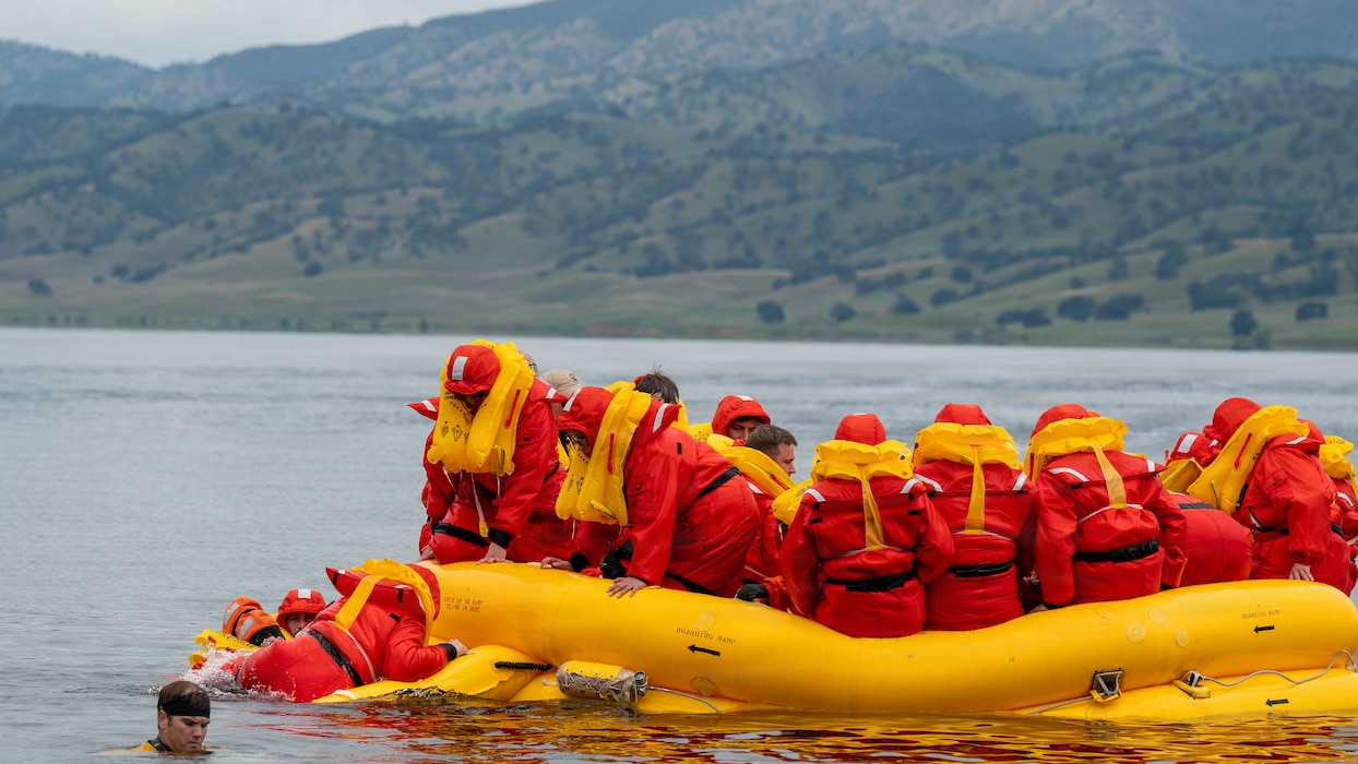 a group of people sitting in a raft on water