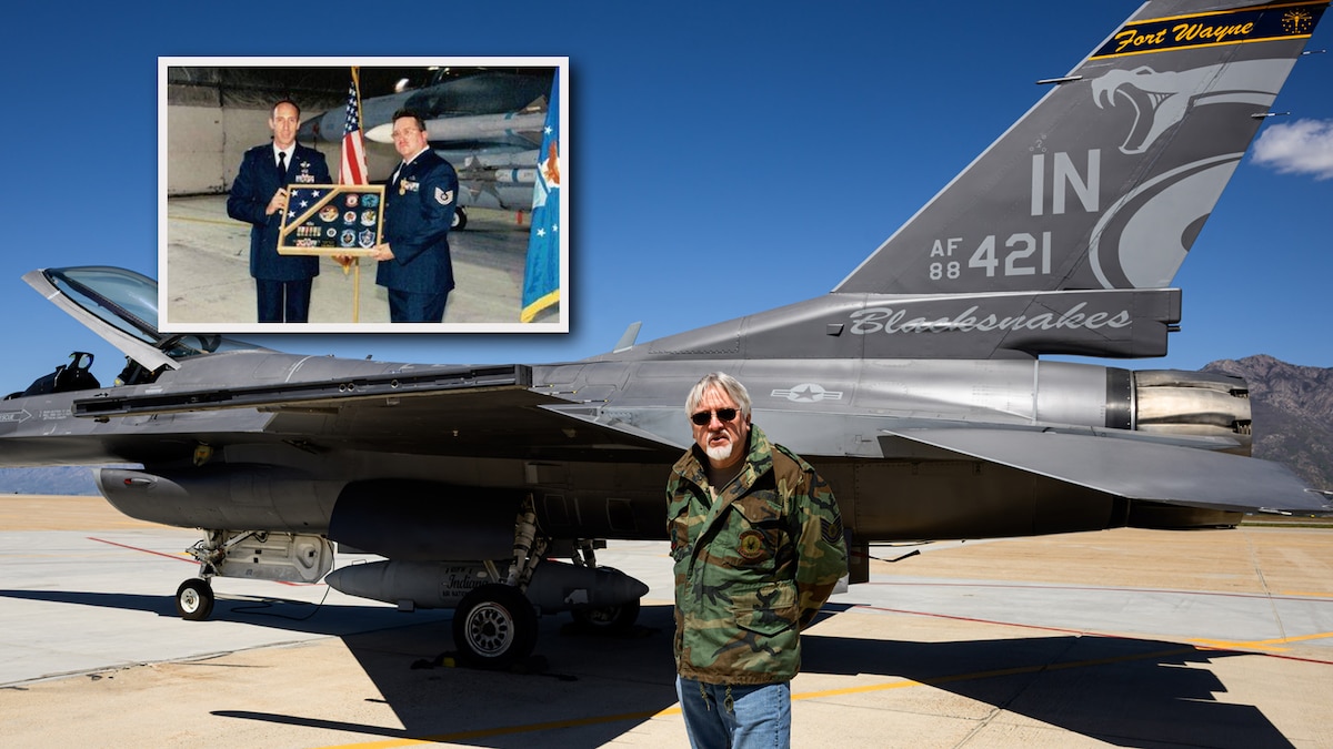 A photo illustration of civilian maintainer Stu Scripter standing in front of an F-16 Fighting Falcon with tail number 88-0421. A smaller inset photo shows a younger Scripter in military uniform holding a shadow box alongside another Airman, posing with the same aircraft 26 years earlier.