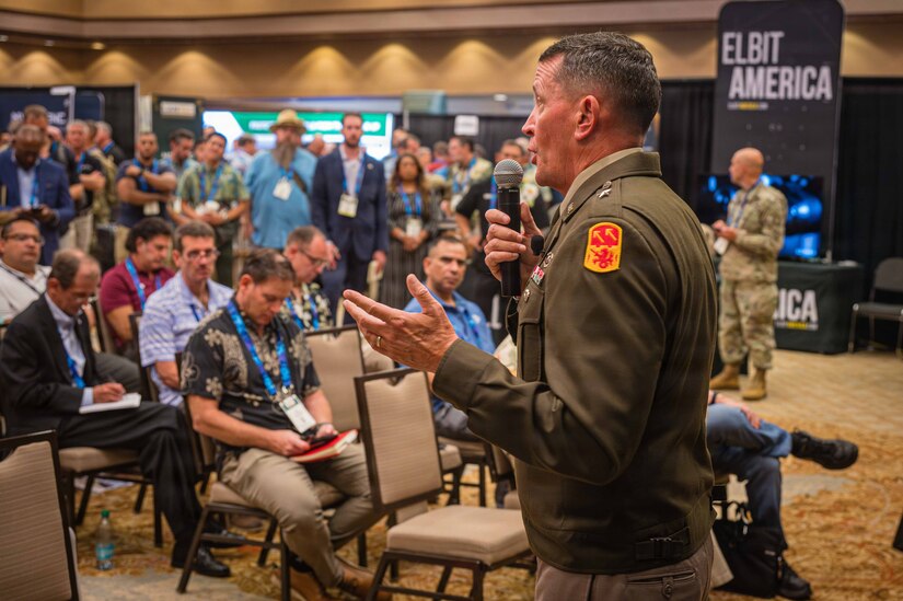 U.S. Army Brig. Gen. William Parker, commanding general of the 94th Army Air and Missile Defense Command (AAMDC), speaks to an audience during the Land Forces of the Pacific Symposium and Exposition (LANPAC) on May 12, 2026.
