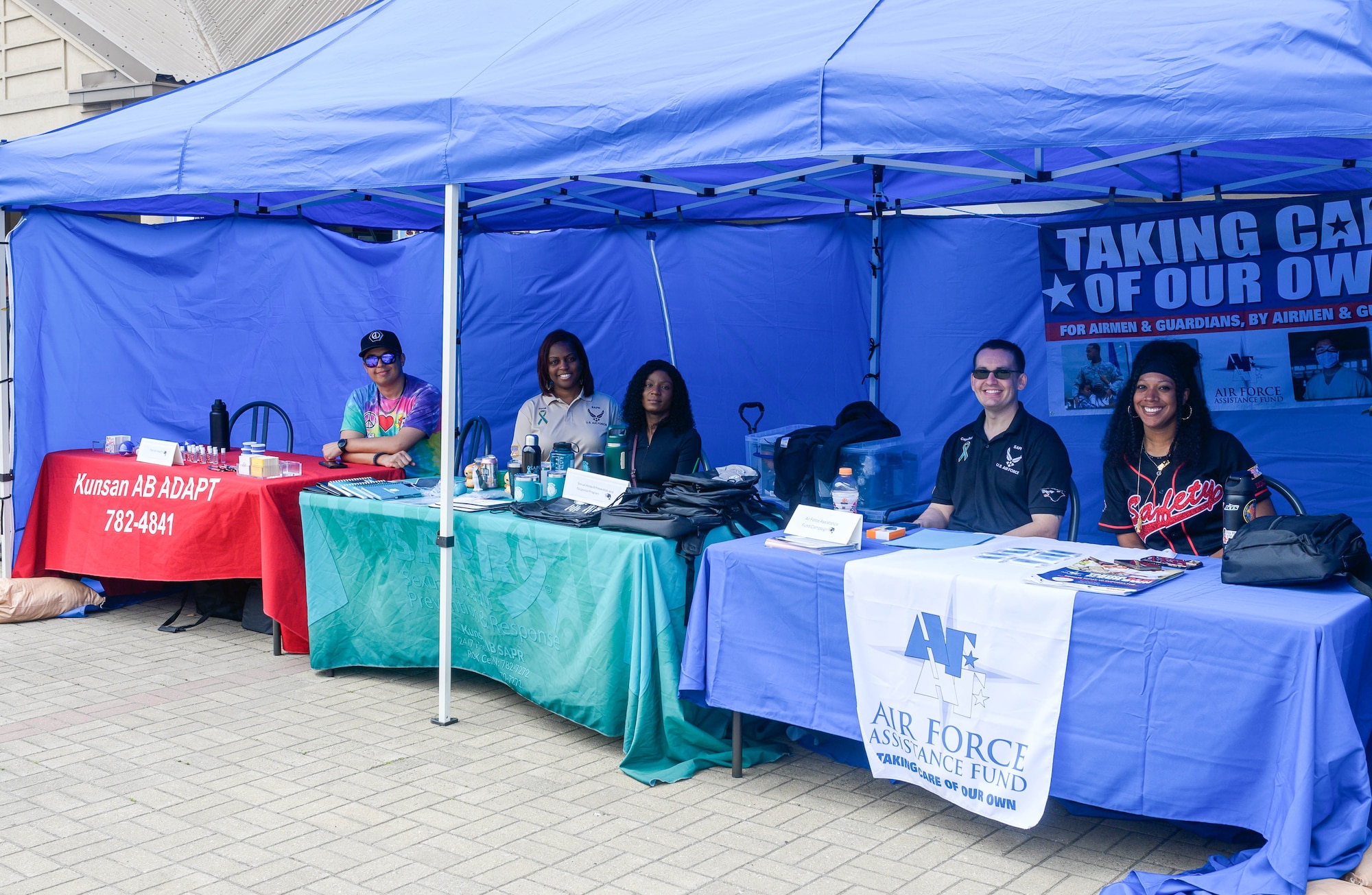 Volunteers host information booths.