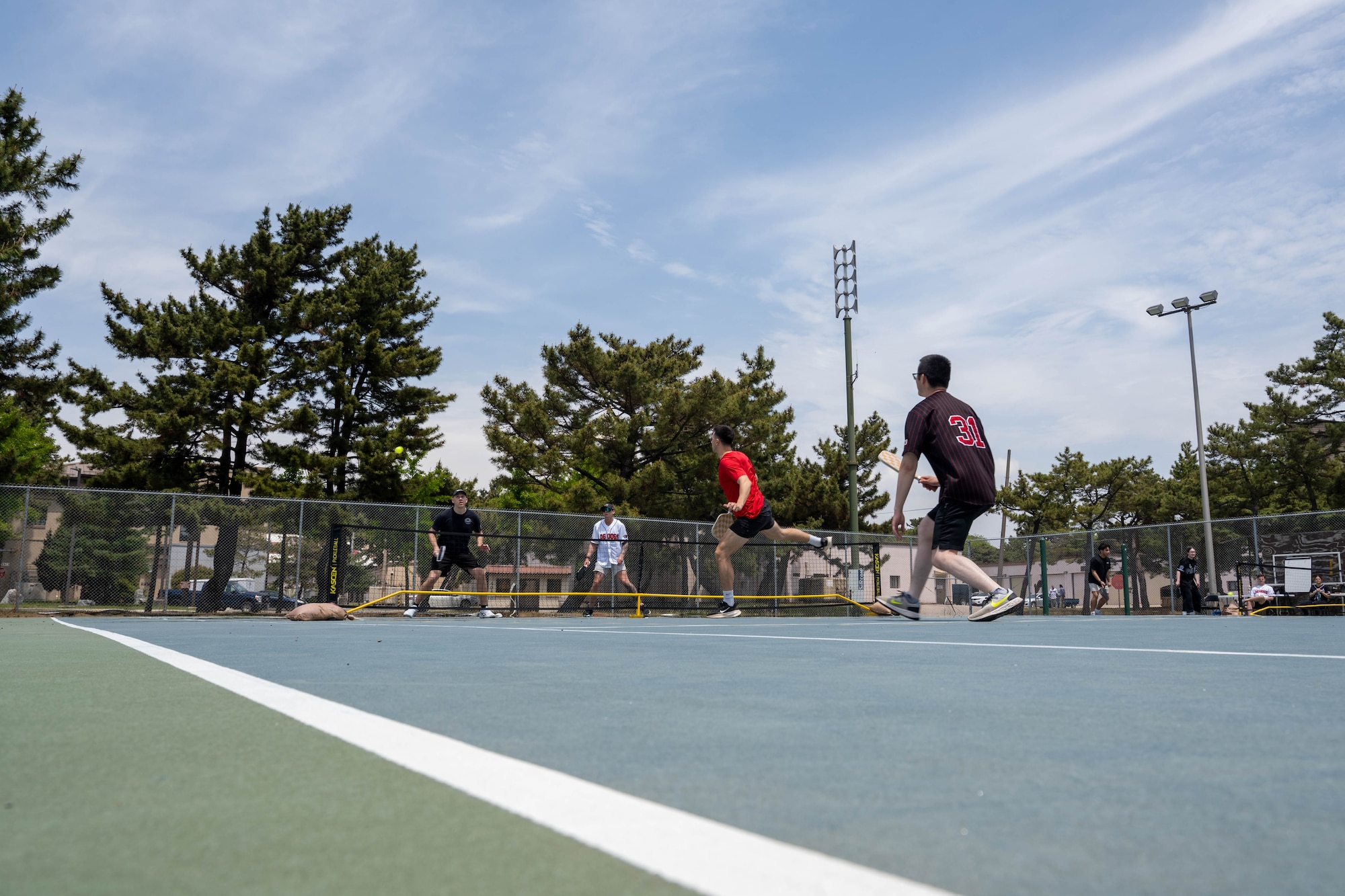 Airmen play pickleball.