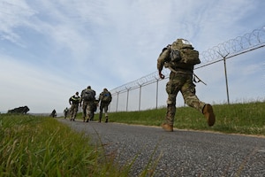 Service members ruck.