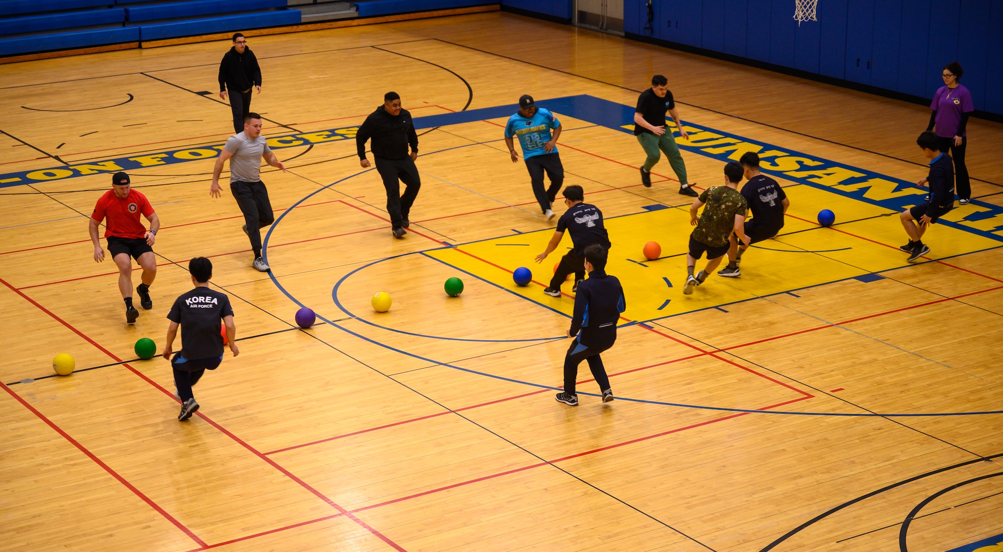 Airmen play dodgeball.