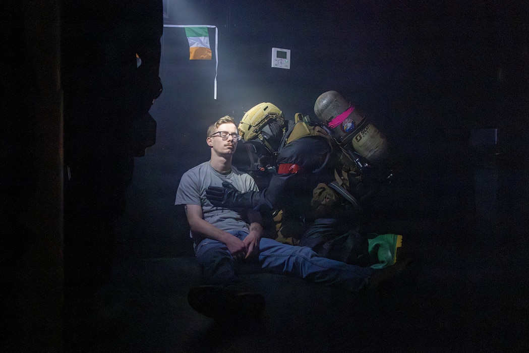 260419-M-GI852-1838 U.S. Navy Hospital Corpsman 3rd Class Jonathan Cabigting, a Washington native with Chemical Biological Incident Response Force, assesses a notional casualty in a simulated contaminated building during a company certification exercise at Hogan’s Alley at the FBI Academy in Quantico, Virginia, April 19, 2026. The exercise included training scenarios focused on reconnaissance, decontamination, casualty rescue and other chemical, biological, radiological and nuclear response tasks to enhance lifesaving capabilities and strengthen unit readiness across diverse operational environments. (U.S. Marine Corps photo by Lance Cpl. Amy Espinoza)