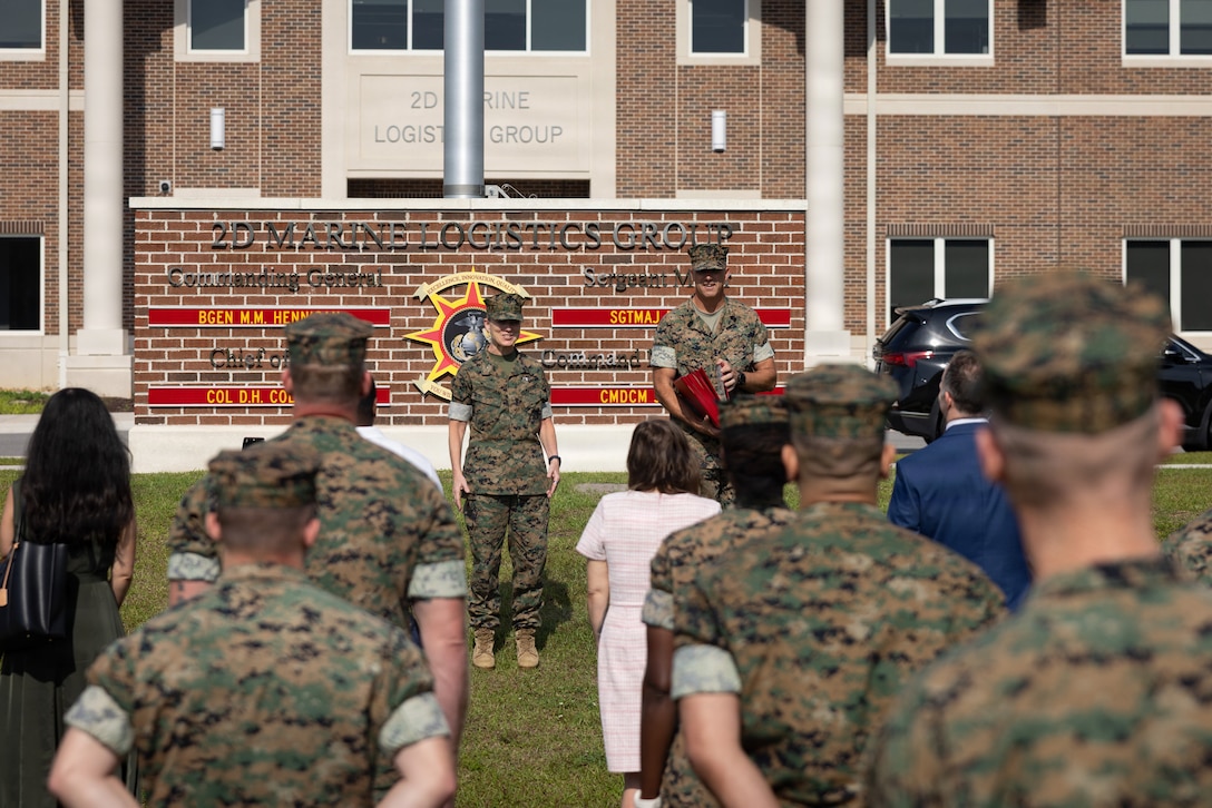 U.S. Marine Corps Brig. Gen. Maura M. Hennigan, center, the commanding general of 2nd Marine Logistics Group, speaks prior to an award ceremony recognizing the work of 2nd MLG federal civilian employees at Marine Corps Base Camp Lejeune, North Carolina, May 11, 2026. The ceremony highlighted the contributions of 2nd MLG equal opportunity advisors and sexual assault response coordinators, alongside personnel recognized for 15 and 40 years of service to the federal government. Hennigan is a native of New York. (U.S. Marine Corps photo by Sgt. Rafael Brambila-Pelayo)