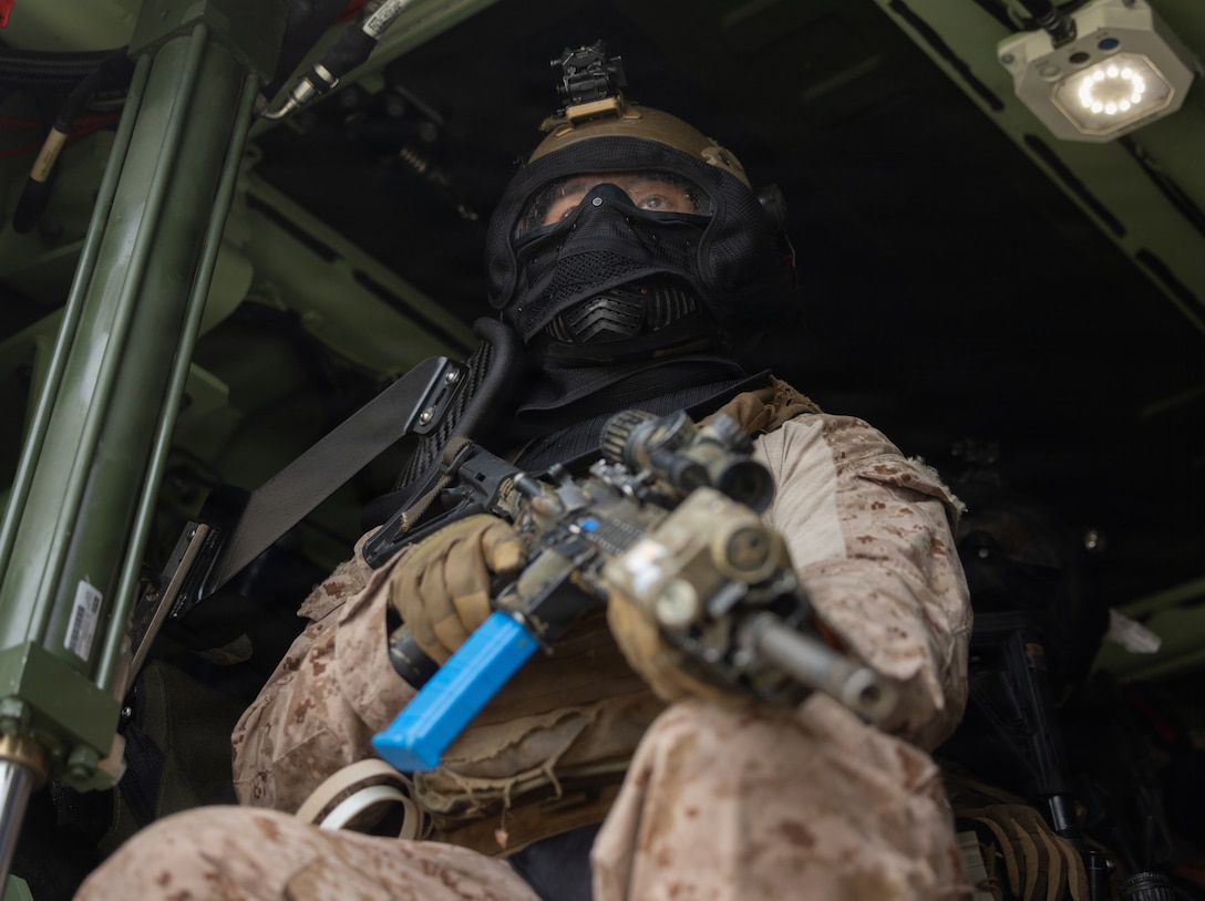 U.S. Marine Corps Lance Cpl. Troy Lee, a rifleman with Alpha Company, 1st Battalion, 8th Marine Regiment, 2nd Marine Division, awaits the start of a mechanized Military Operations in Urban Terrain training exercise at Marine Corps Base Camp Lejeune, North Carolina, May 7, 2026. The MOUT training was used as preparation for a Marine Corps Combat Readiness Evaluation and is important for future integration of mechanized operations. (U.S. Marine Corps photo by Lance Cpl. Isaac Garza)