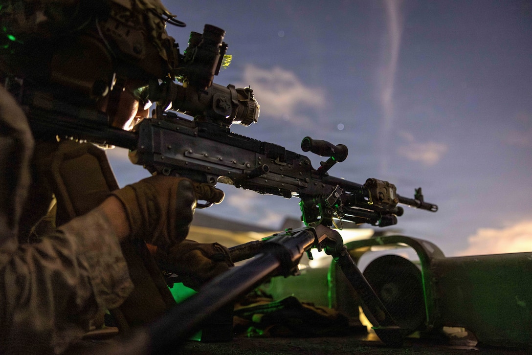 A U.S. Marine with Battalion Landing Team 3/5, 11th Marine Expeditionary Unit, scans for vessels on the flight deck of Wasp-class amphibious assault ship USS Boxer (LHD 4) while transiting the Balabac Strait, April 27, 2026. The 11th MEU, embarked aboard the Boxer Amphibious Ready Group, is a persistent, combat credible force contributing to deterrence and crisis response in the U.S. 7th Fleet area of operations. U.S. 7th Fleet, the U.S. Navy's largest forward-deployed numbered fleet, routinely interacts and operates with allies and partners to preserve a free and open Indo-Pacific. (U.S. Marine Corps photo by Sgt. Trent A. Henry)