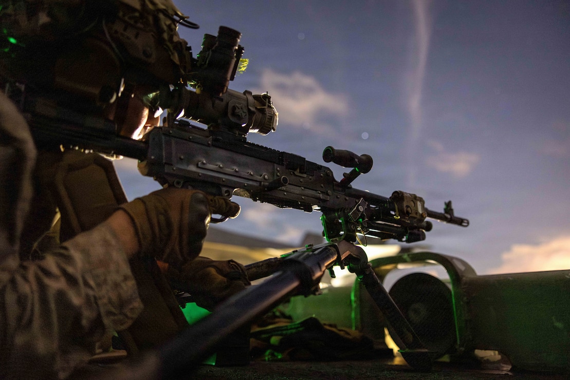 A U.S. Marine with Battalion Landing Team 3/5, 11th Marine Expeditionary Unit, scans for vessels on the flight deck of Wasp-class amphibious assault ship USS Boxer (LHD 4) while transiting the Balabac Strait, April 27, 2026. The 11th MEU, embarked aboard the Boxer Amphibious Ready Group, is a persistent, combat credible force contributing to deterrence and crisis response in the U.S. 7th Fleet area of operations. U.S. 7th Fleet, the U.S. Navy's largest forward-deployed numbered fleet, routinely interacts and operates with allies and partners to preserve a free and open Indo-Pacific. (U.S. Marine Corps photo by Sgt. Trent A. Henry)