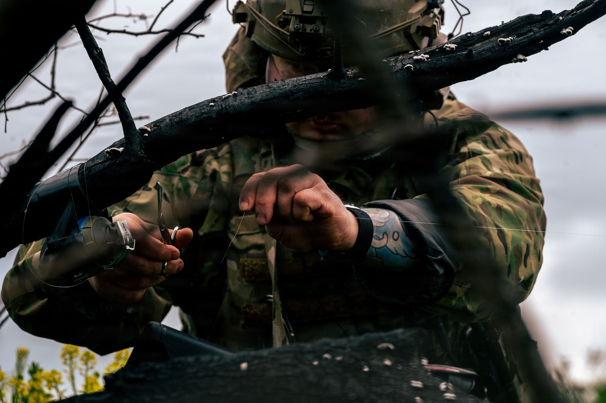 U.S. Air Force Staff Sgt. Taylor Lanteine, 786th Civil Engineer Squadron Explosive Ordnance Disposal flight team leader, clips concealed explosive devices