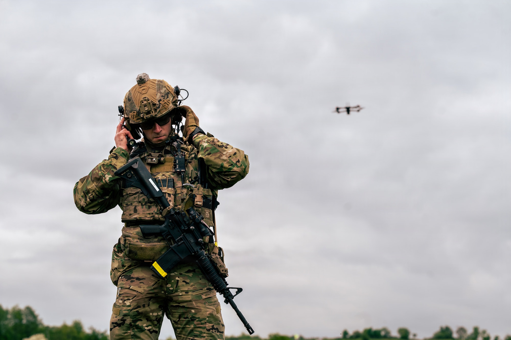 U.S. Air Force Staff Sgt. Anthony Granata, 786th Civil Engineer Squadron Explosive Ordnance Disposal flight team leader, adjusts his helmet after a drone swarm exercise
